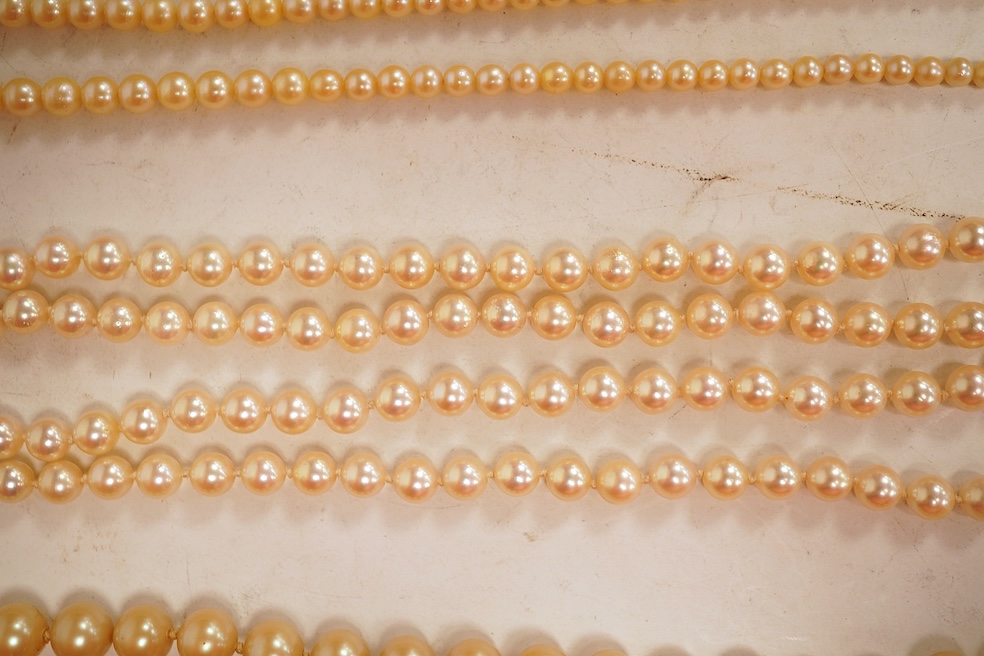 Two cultured pearl necklaces, each composed of a single row of cultured pearls, one with pearls 3-7mm diameter, length 44cm, clasp stamped 9CT; the other with pearls approximately 6mm diameter, length 86cm, clasp with Br